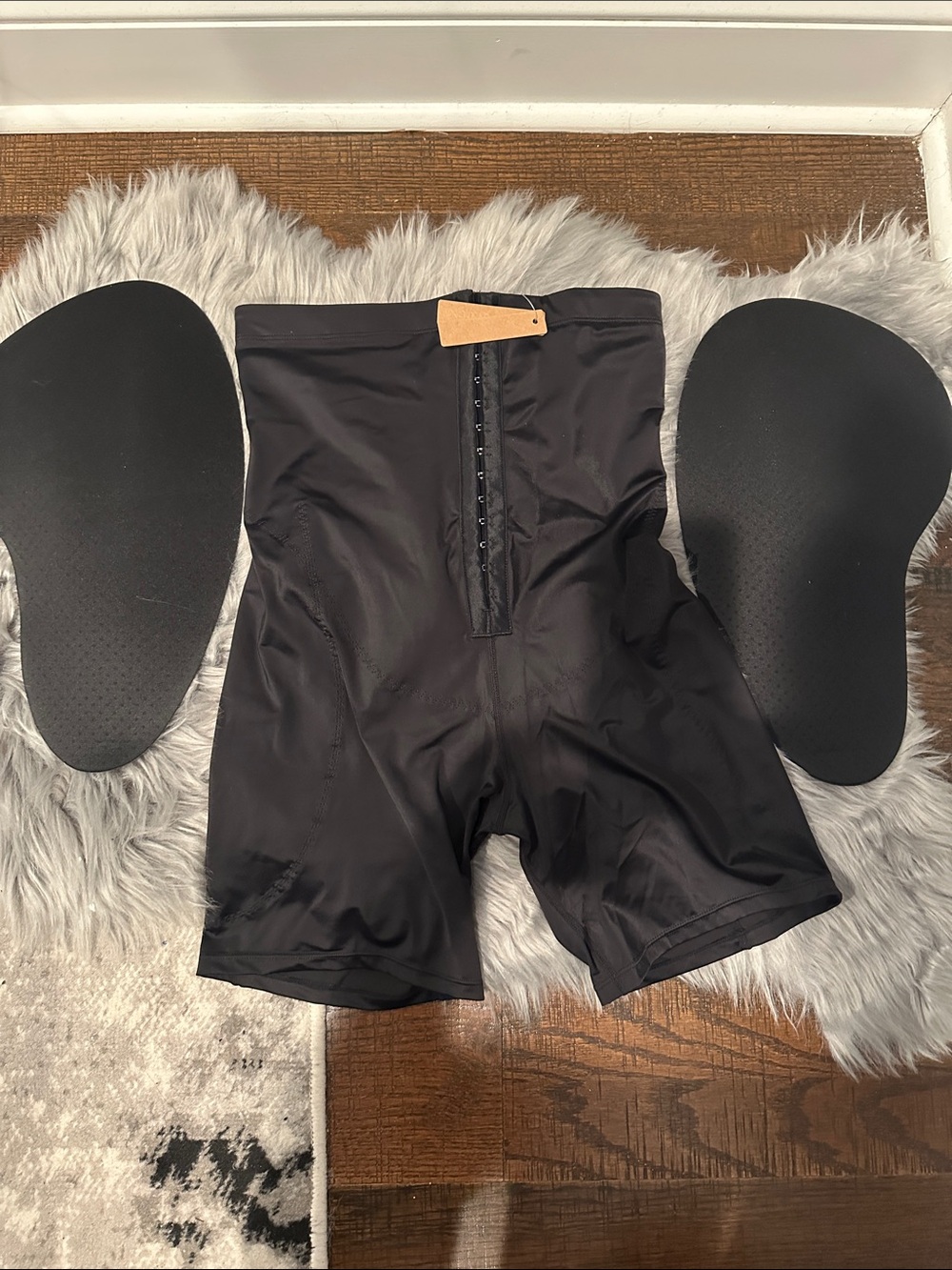SPAPELLX Black High-Waist Shaping Shorts with Hook Closure and hip enhancements.